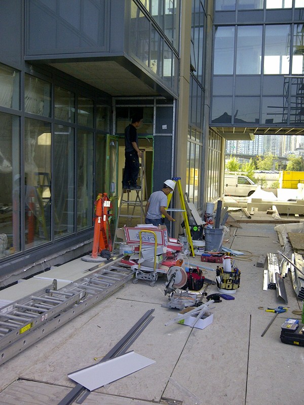 installation of new curtain wall window frame and entry door