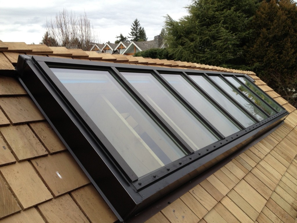 Installed brand new aluminum rafter purlin skylight system with double pane safety glass. This skylight were custom sized and custom built at our shop to fit new openings. Aluminum skylight frames were thermally broken and double pane Low-E glass which makes the system as energy efficient as any other skylight system on the market. All flashings were installed properly with current roof to stop any leaks from coming into the home.