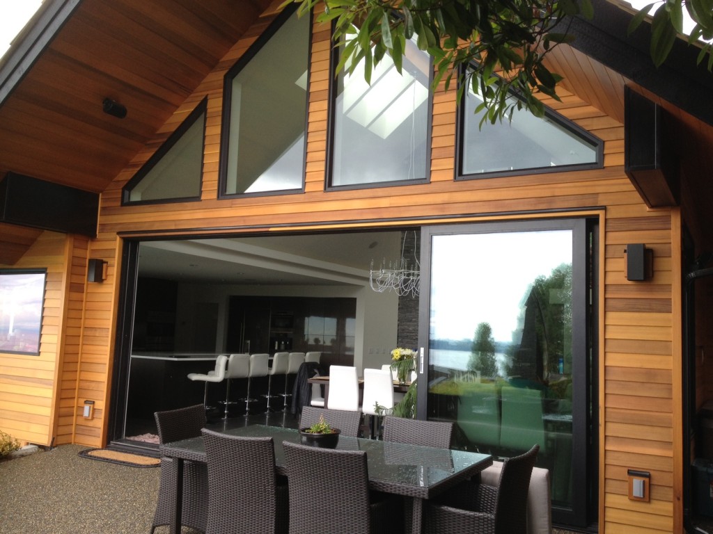 Installed brand new large oversized aluminum sliding glass door system into a residential home in West Vancouver. This door comes with thermally broken frames and double pane glass which makes it energy efficient while the sheer size of the doors gives the back of the home maximum ocean views.