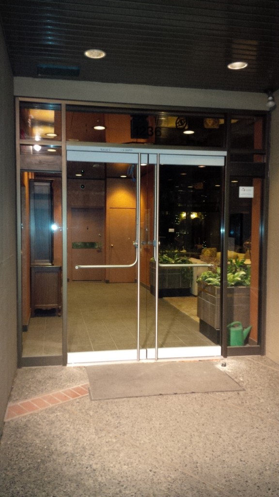 New elegant frameless glass doors system for hi rise apartment condo building in Downtown Vancouver. Door handles from inside are push panic for emergency exit access, while the electric strike locking system works seamlessly with the existing building's intercom system to allow for a swipe from card reader to allow access from the outside into the building.