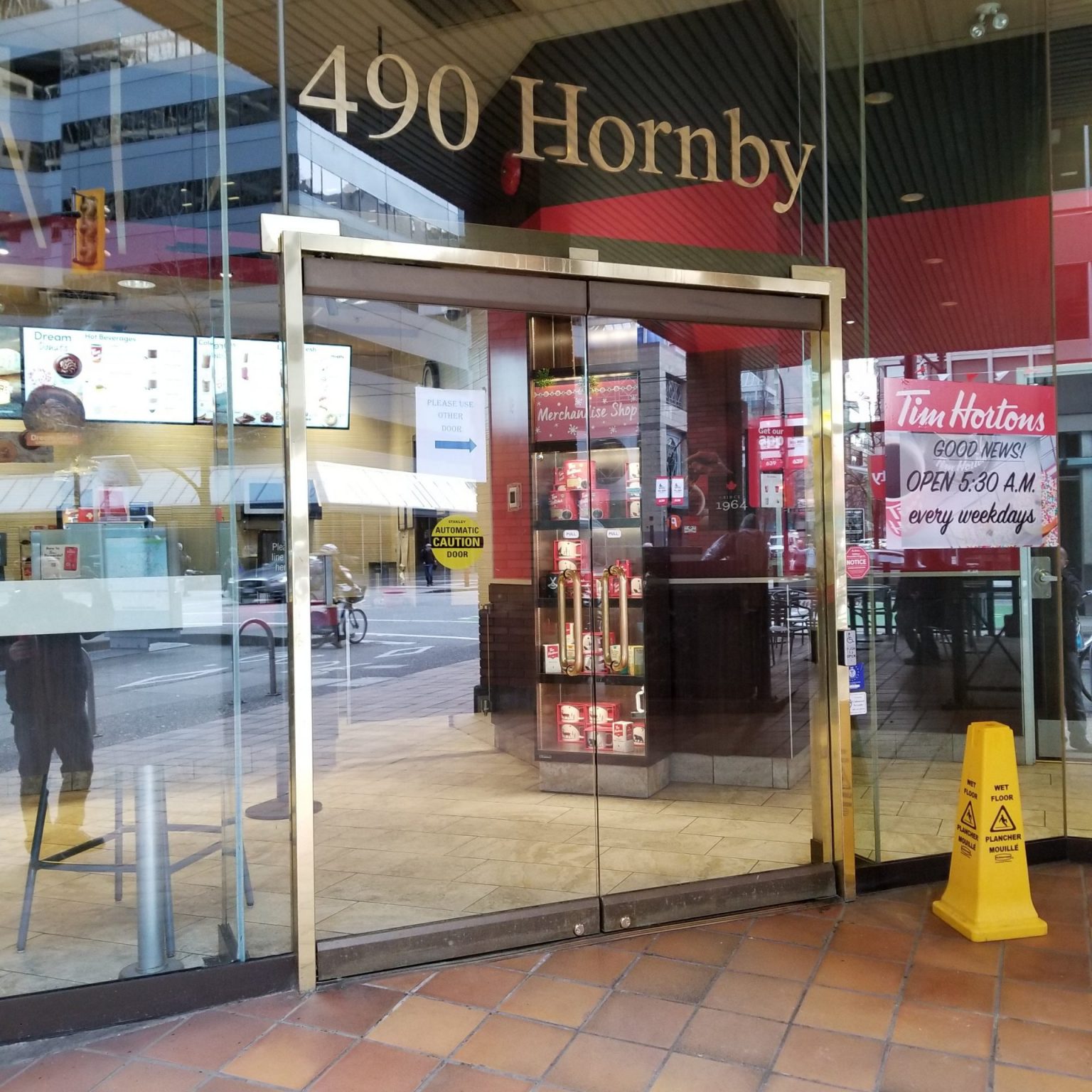 Frameless glass swing door with aluminum side windows