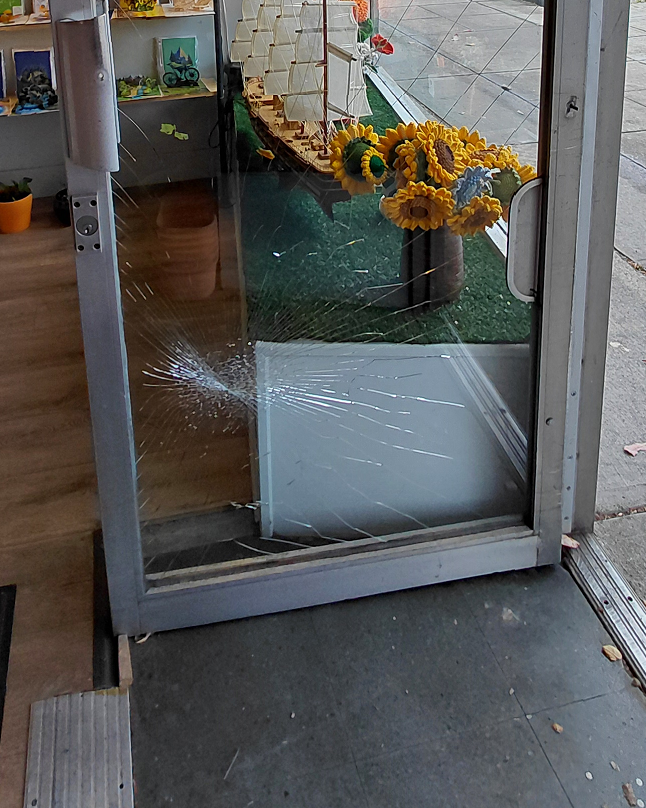 Broken glass door requiring emergency glass replacement